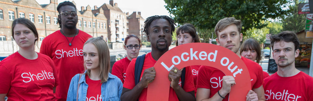 People in red Shelter t-shirts campaigning against DSS benefits discrimination