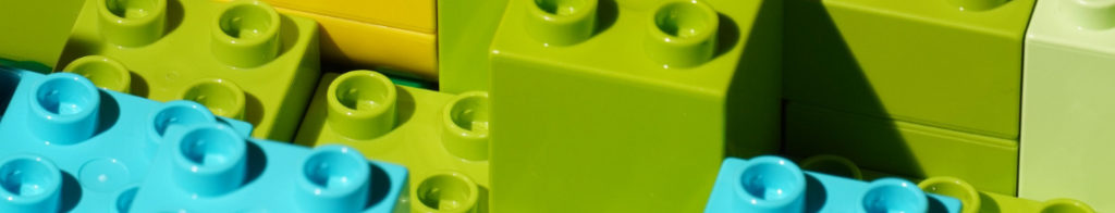 Close-up image of blue and green Lego blocks